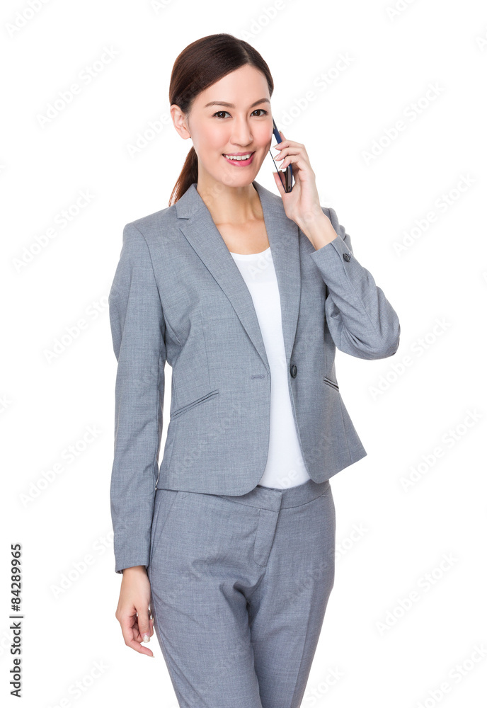 Young businesswoman talk to mobile phone Young businesswoman talk to mobile phone