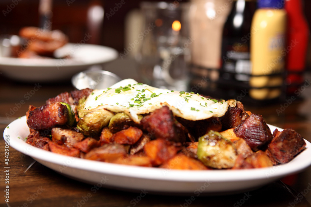 Corned beef hash with brussel sprouts and eggs over easy. Corned beef hash with brussel sprouts and eggs over easy.