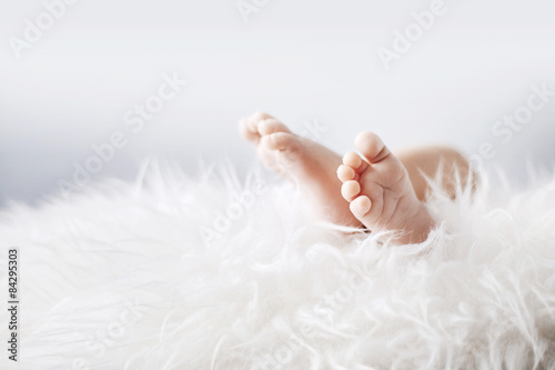 Little feet of a newborn child photo