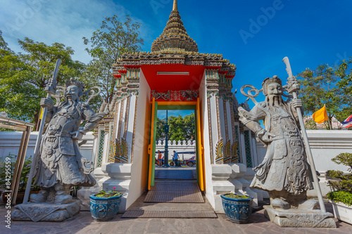 Statues at Wat Pho in Bangkok, Thailand photo