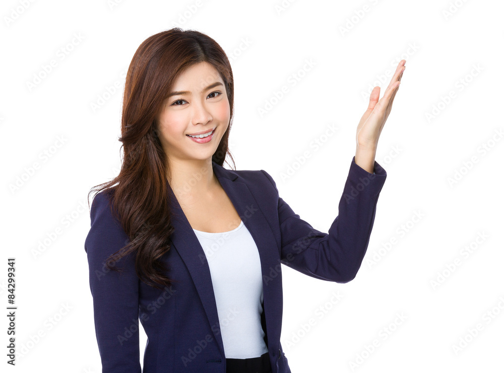 Young businesswoman with hand showing something Young businesswoman with hand showing something