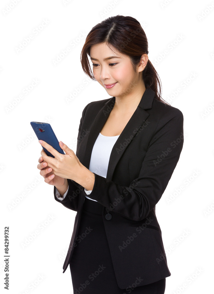 Businesswoman read the message on cellphone Businesswoman read the message on cellphone