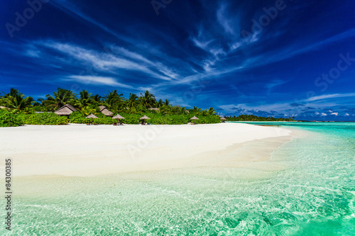 Fototapeta Naklejka Na Ścianę i Meble -  Palm trees over stunning lagoon and white sandy beach