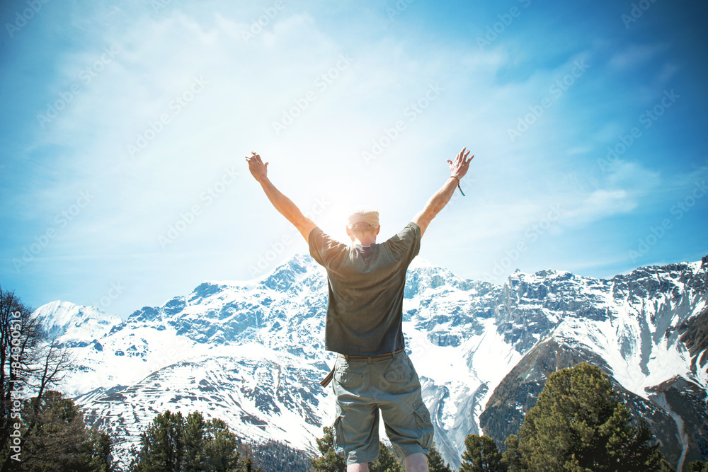 Happy Man exulting after reaching the top of the mountain Happy Man exulting after reaching the top of the mountain