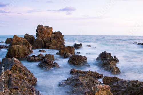 Rock in sea with wave on sunset  time © pingpao