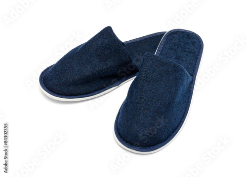 Foto A pair of blue slippers on a white background