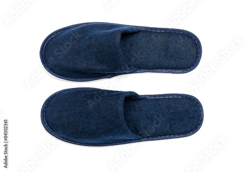Foto A pair of blue slippers on a white background