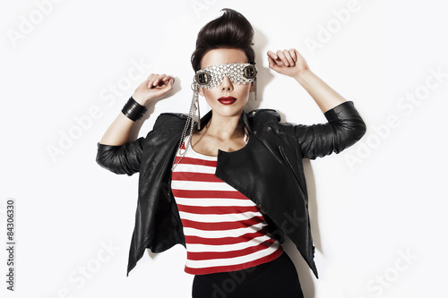 rock n roll woman in glasses and black jacket © alexbutscom