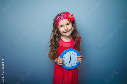 a girl of seven European appearance brunette in a bright dress h