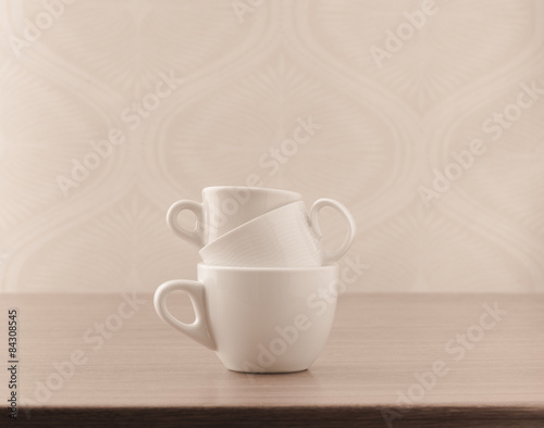 Empty coffee cups on wooden table