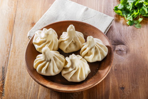 khinkali cooked on a ceramic plate