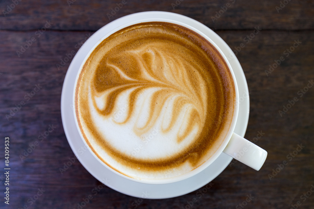 art latte coffee on white cup art latte coffee on white cup