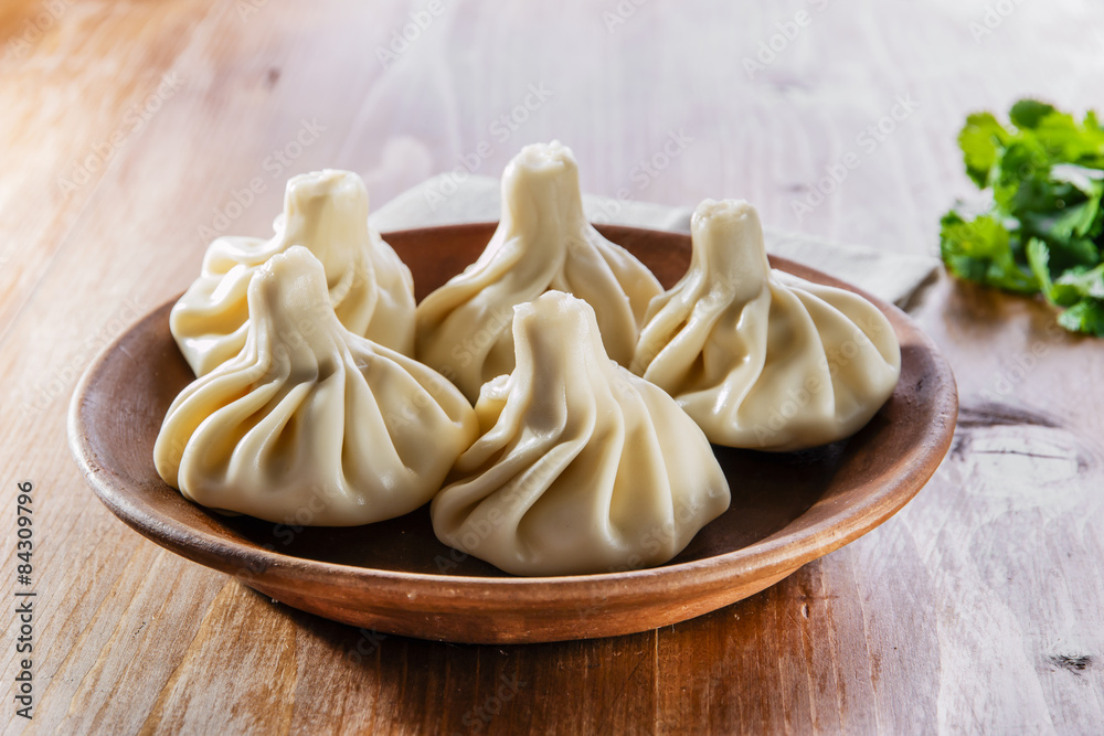 khinkali cooked on a ceramic plate khinkali cooked on a ceramic plate