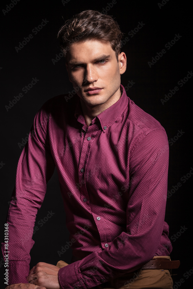 Fototapeta premium handsome young man posing on dark background.
