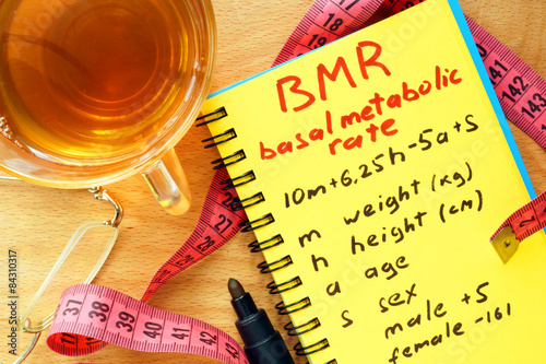 BMR basal metabolic rate formula in a notepad. photo