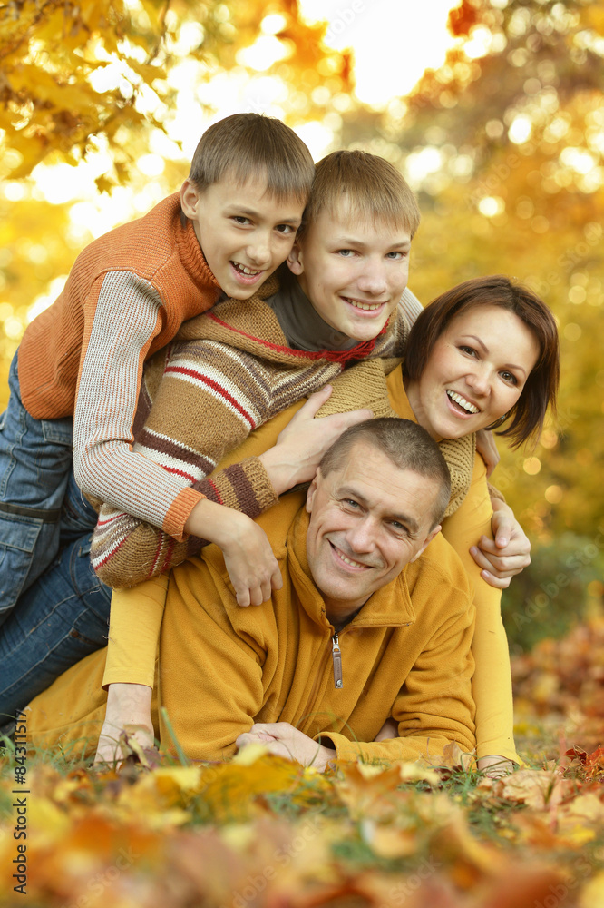 Family relaxing in autumn park Family relaxing in autumn park