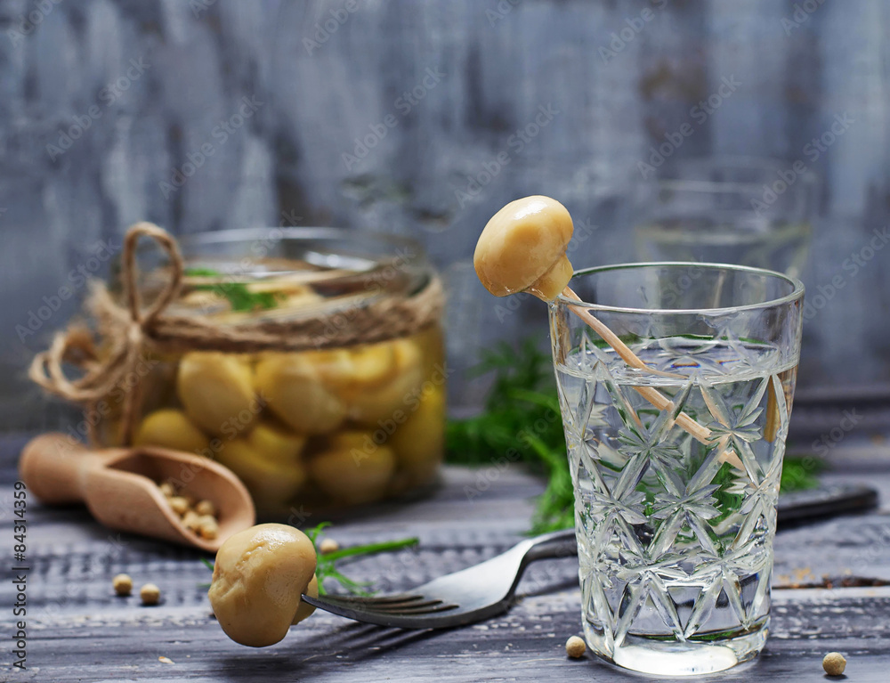 Glass of Russian vodka and pickled mushrooms Glass of Russian vodka and pickled mushrooms