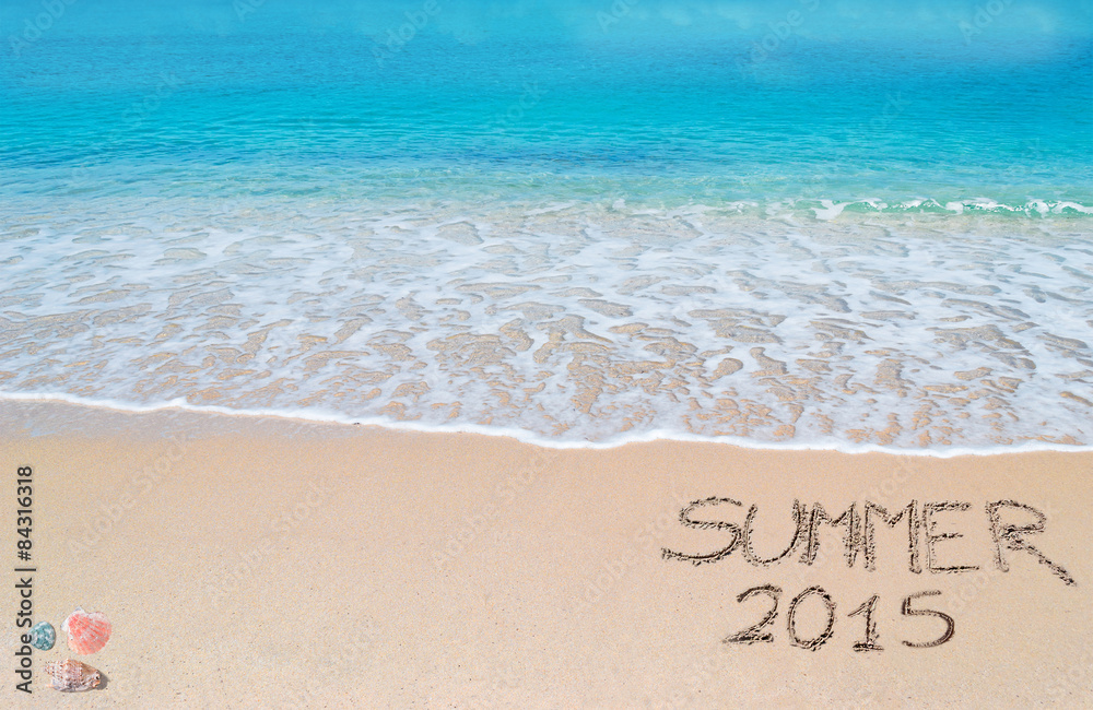 summer 2015 written on a tropical beach summer 2015 written on a tropical beach