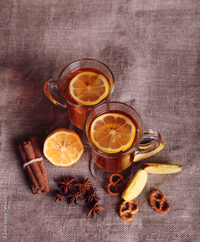 Fototapeta premium two glasses of mulled wine on the old wooden table in winter frosty day