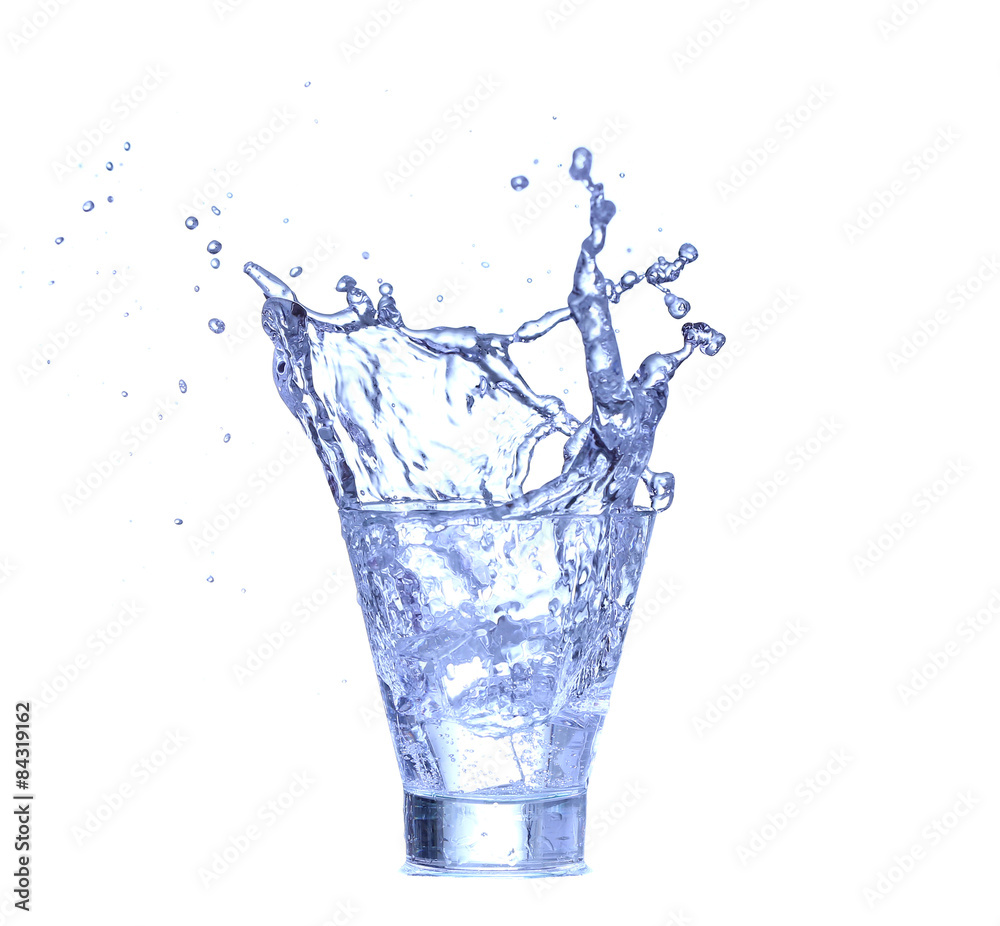 Glass of water, ice and slice of fresh lemon on a white background