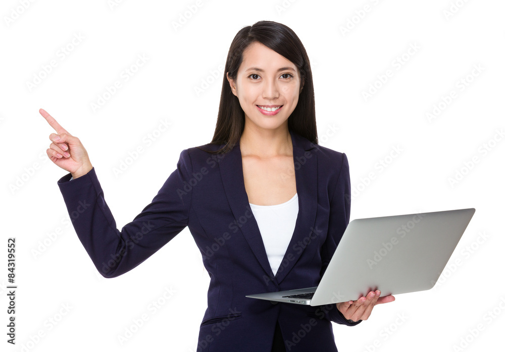 Young businesswoman hold with laptop computer and finger point u Young businesswoman hold with laptop computer and finger point u