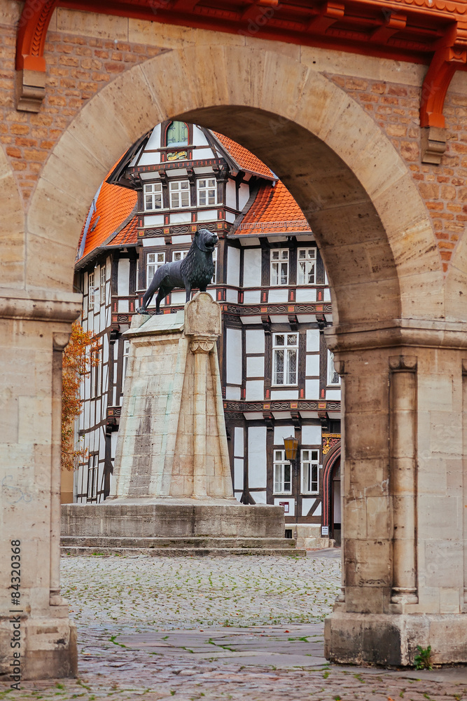 Lion statue and old timbered house in Braunschweig patio