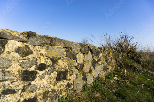 Old stone fence and blue sky