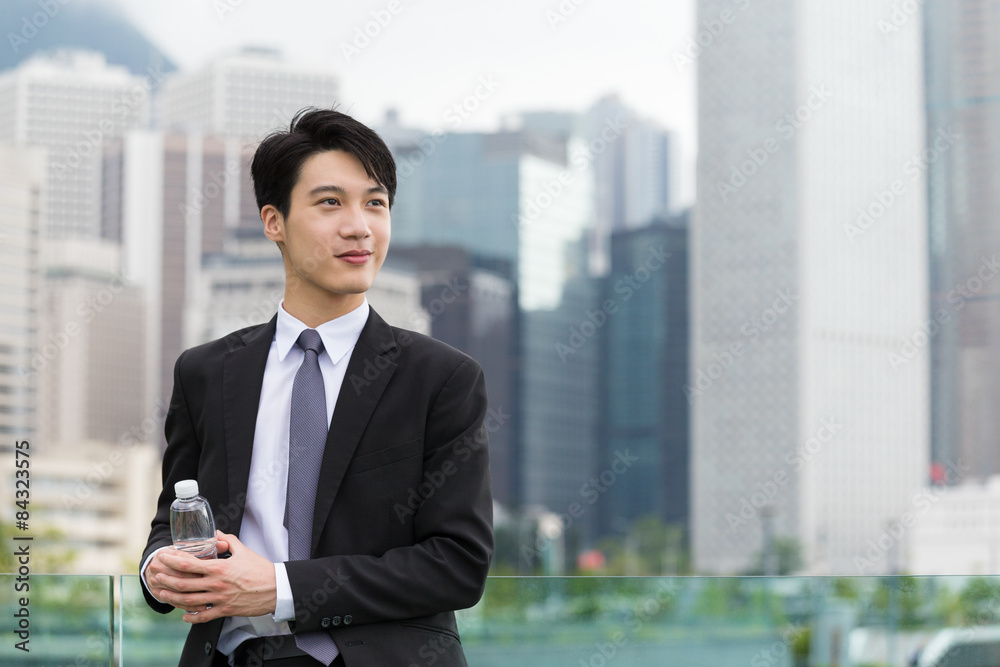 Businessman think of idea and standing outdoor Businessman think of idea and standing outdoor
