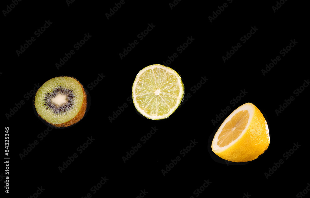 Citrus fruits on black background