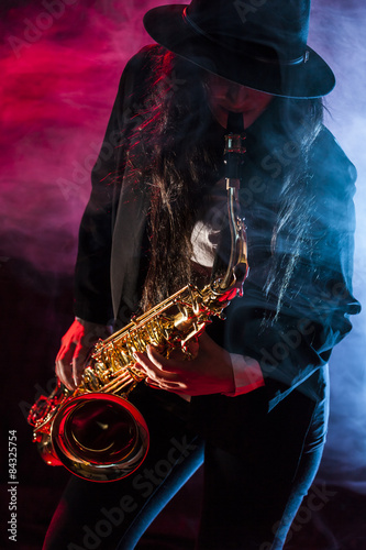 Canvas Print Young lady with her saxophone
