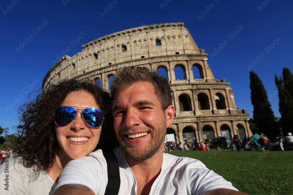 Naklejka premium Couple of tourist in Rome near the Colosseum