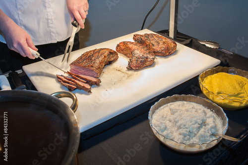 Slicing the tri-tip steak photo