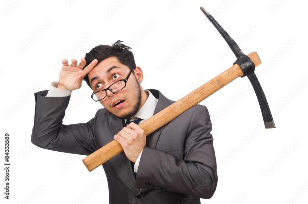 Young businessman holding a tool isolated on white Young businessman holding a tool isolated on white