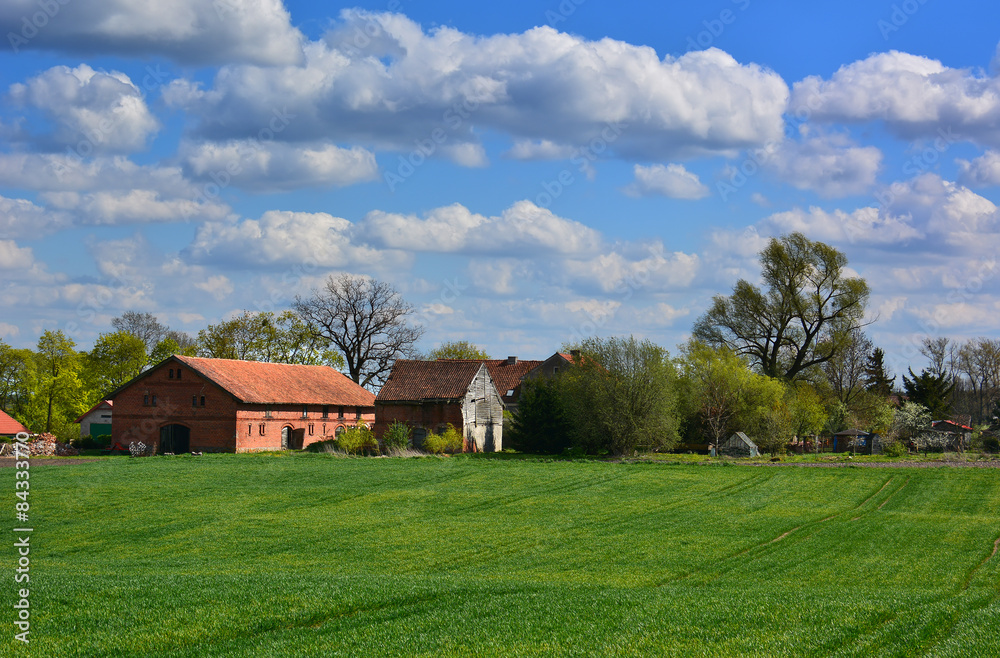 Spring landscape with old farm