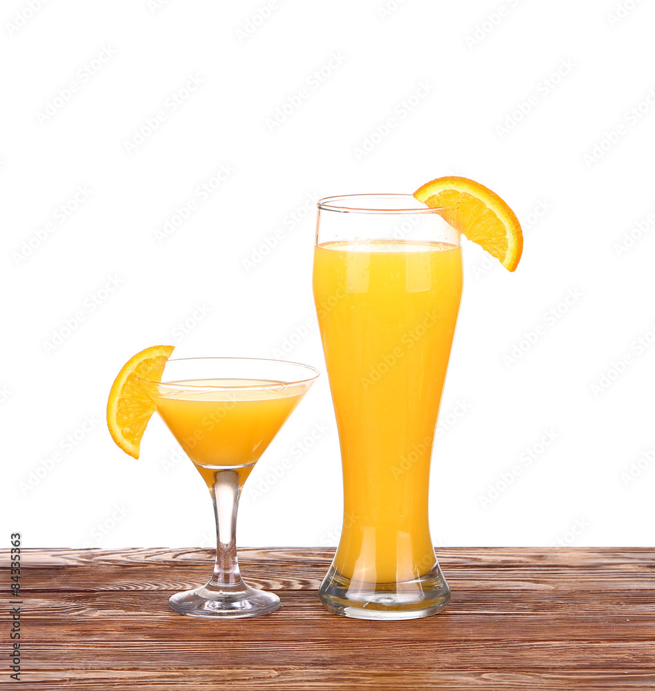 Glass of freshly pressed orange juice with sliced orange Glass of freshly pressed orange juice with sliced orange
