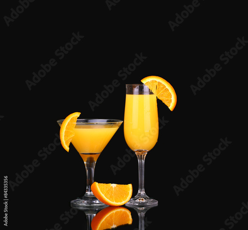 fresh organic orange juice and vodka in a tall glass  