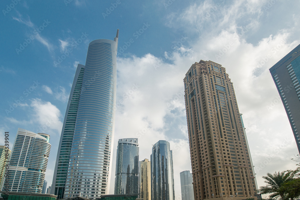 Fototapeta premium Tall skyscrapers in Dubai near water