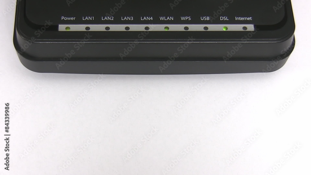Modem on white background; lights blinking while connecting to internet Modem on white background; lights blinking while connecting to internet