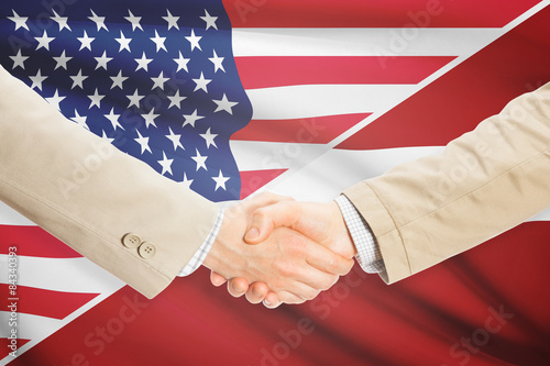 Businessmen handshake - United States and Latvia