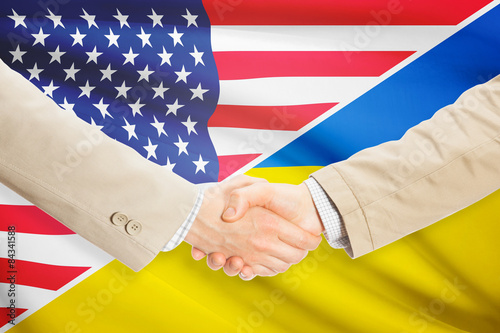 Businessmen handshake - United States and Ukraine