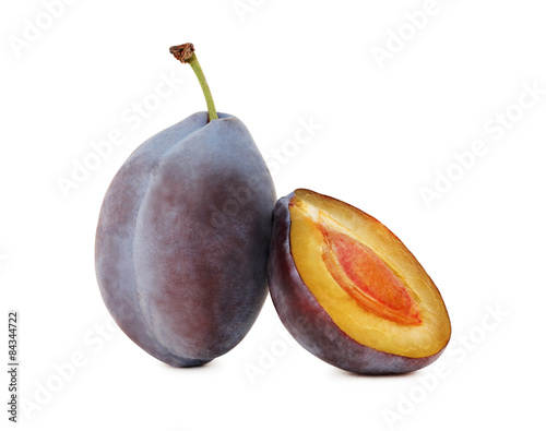 One whole and a half ripe plum (isolated)