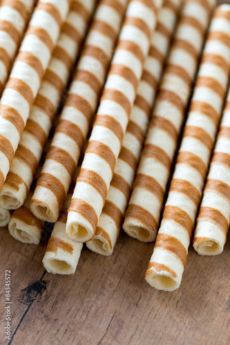 waffle rolls on wooden surface