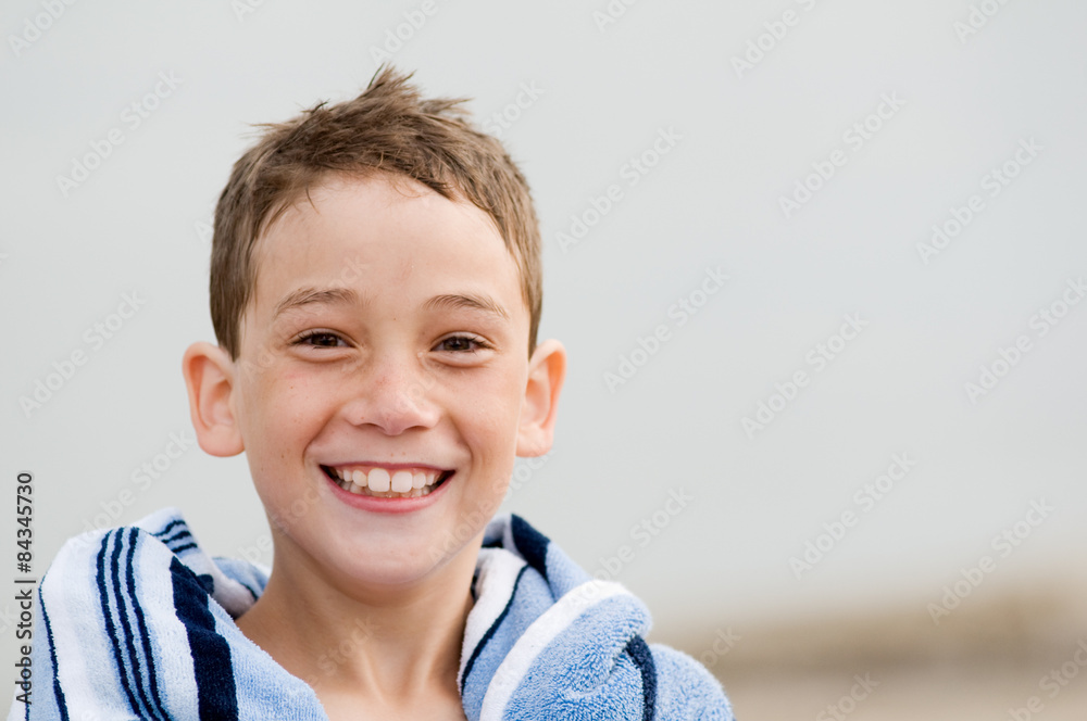 closeup of a boy with a big smile