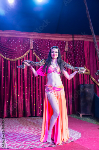 Obraz na płótnie Exotic Belly Dancer with Large Snake on Stage w salonie