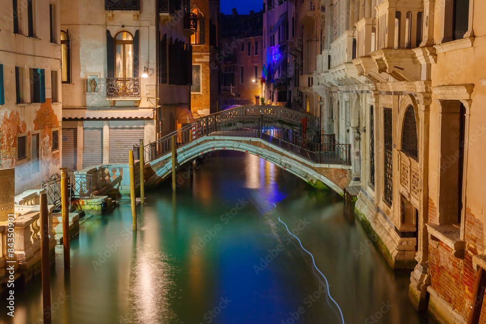 Night lateral canal and bridge in Venice, Italy