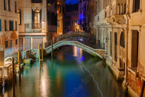 Night lateral canal and bridge in Venice, Italy © Kavalenkava