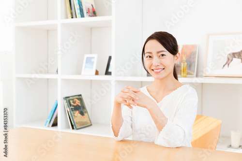 young asian woman relaxing in living room