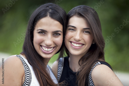 Two young women smiling at the camera