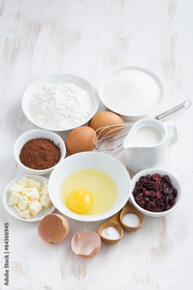fresh ingredients for baking on white table, vertical, top view fresh ingredients for baking on white table, vertical, top view