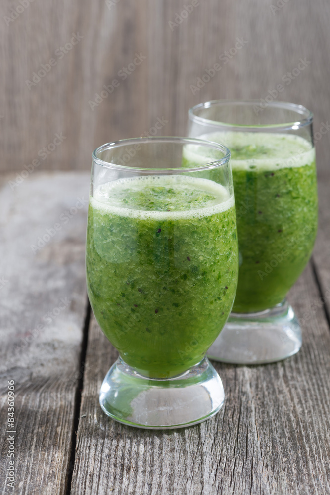 Green fruit and vegetable smoothies, vertical Green fruit and vegetable smoothies, vertical